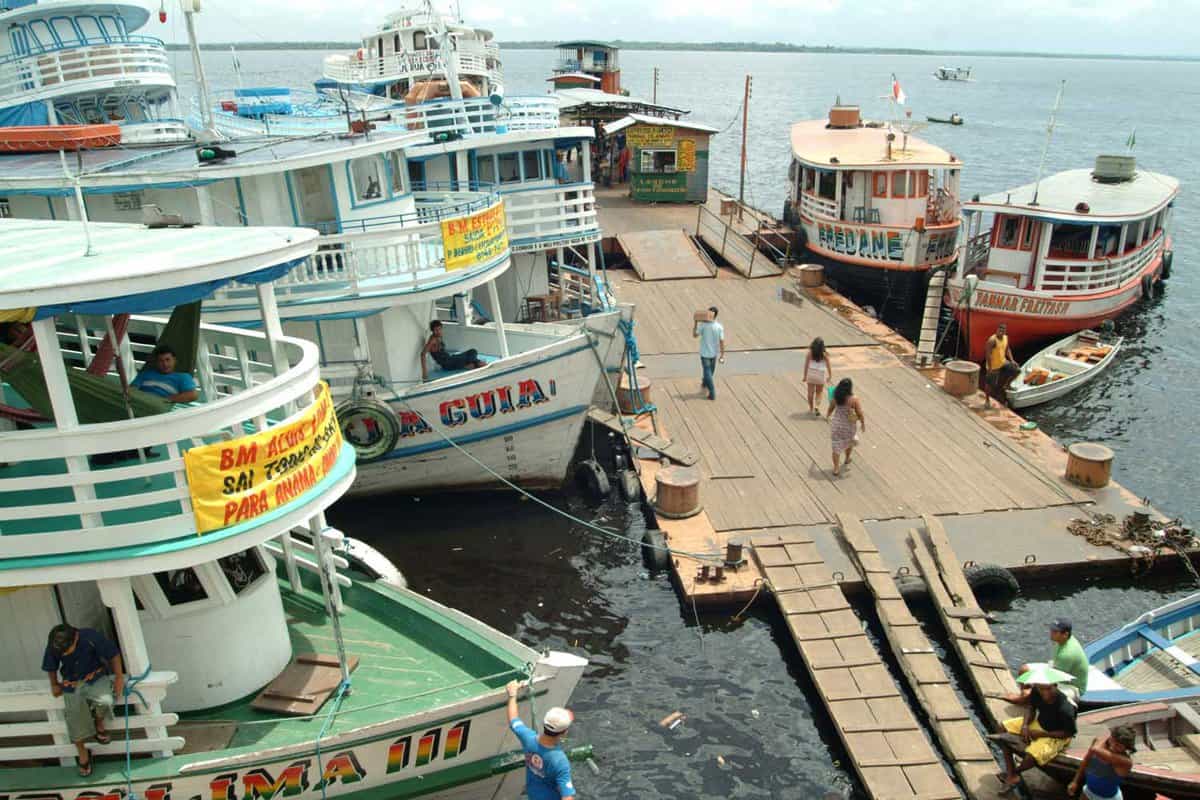 Boats transporting people and passengers anchored at the pier of Manaus, Negro River