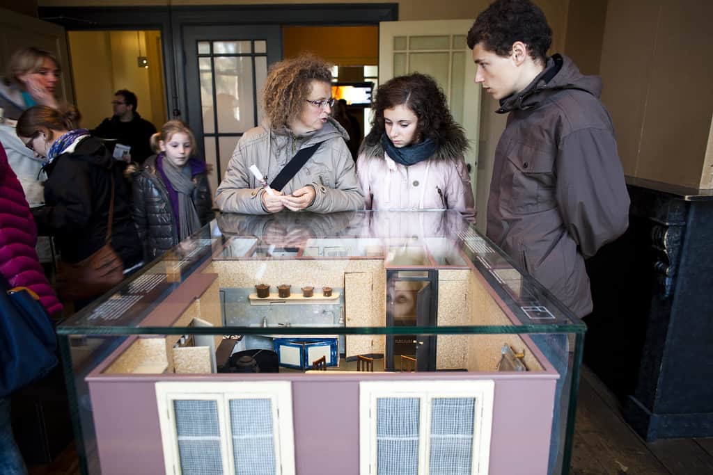 People viewing the model of Anne Frank's house