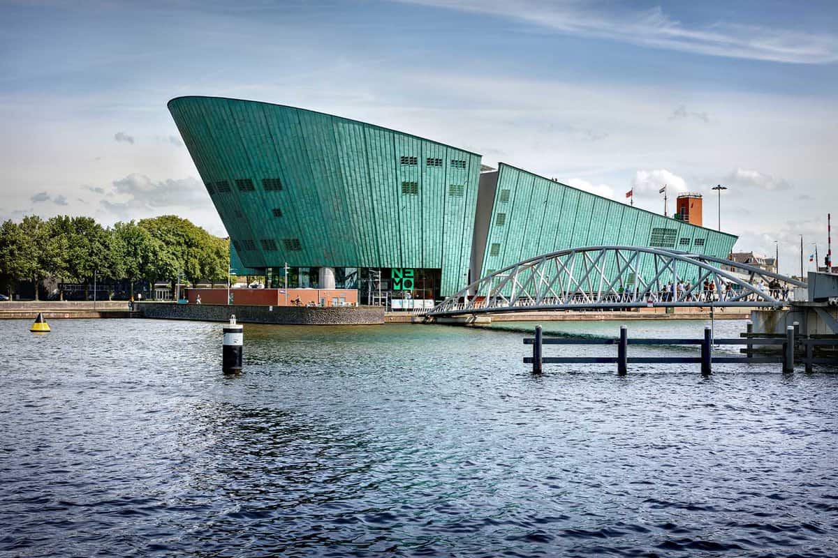 External view of the striking green building shaped like the prow of a ship