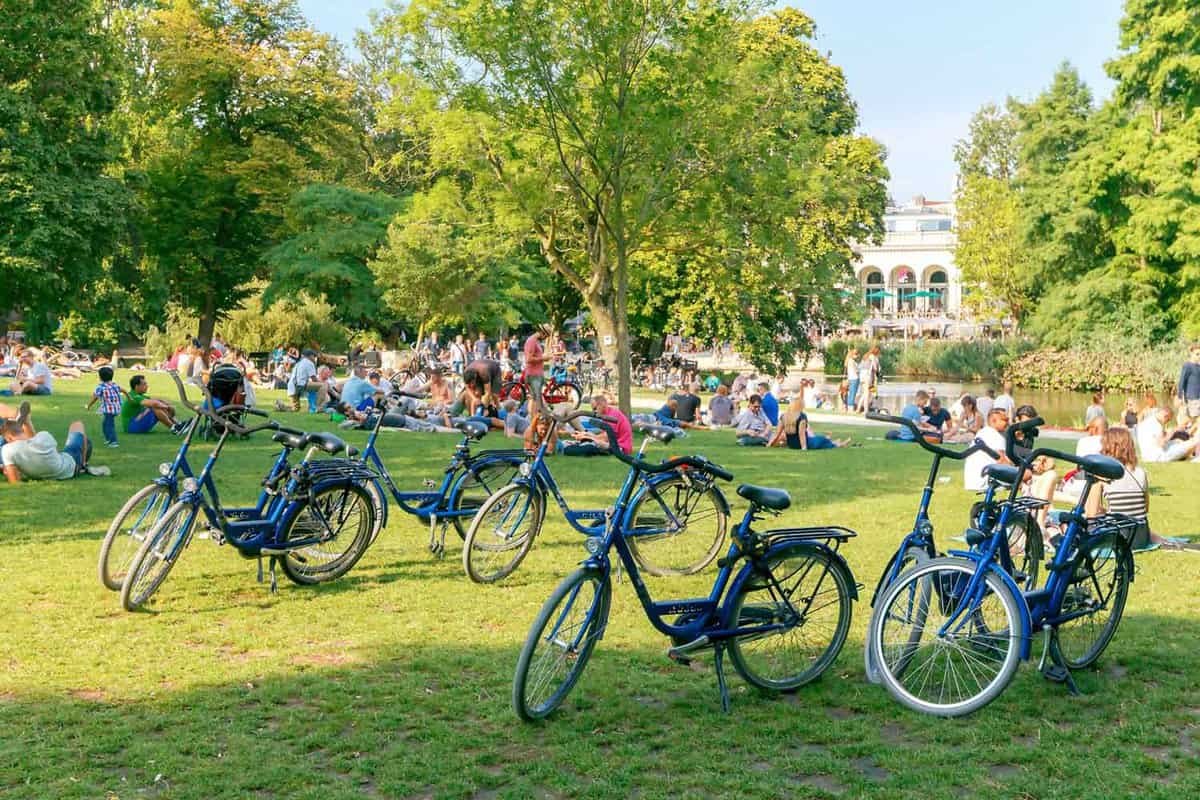 row of bikes and crowds of seated people in the background