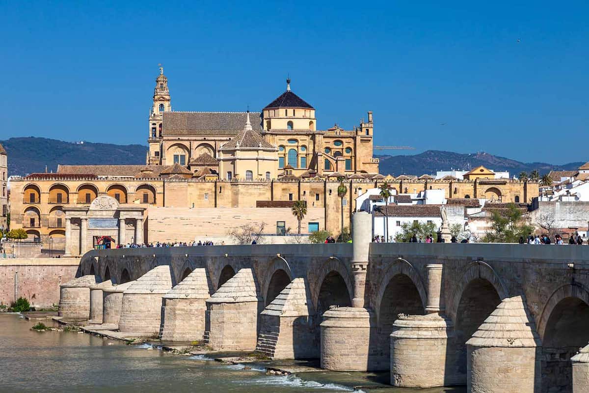 Cityscape of Cordoba with roman bridge and Mezquita