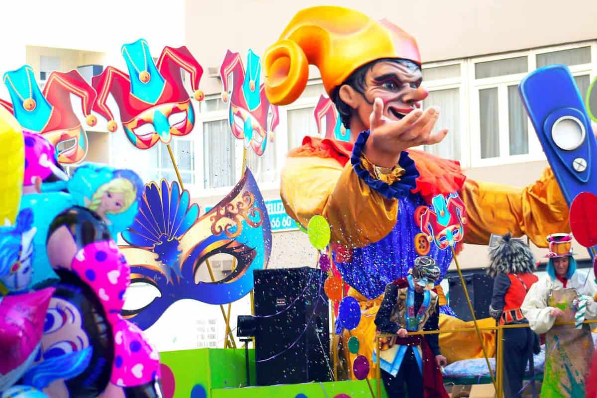 A parade float with a jester effigy