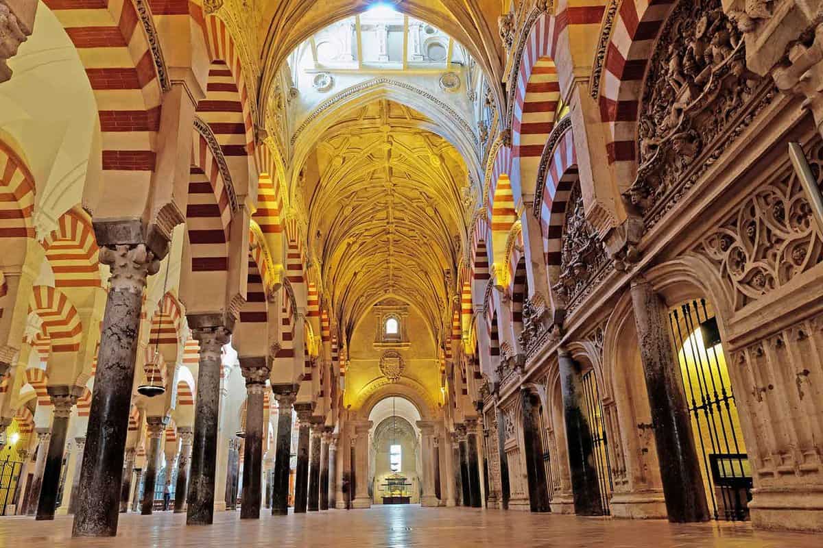 Interior of the Mezquita, large striped archways and a high ceiling