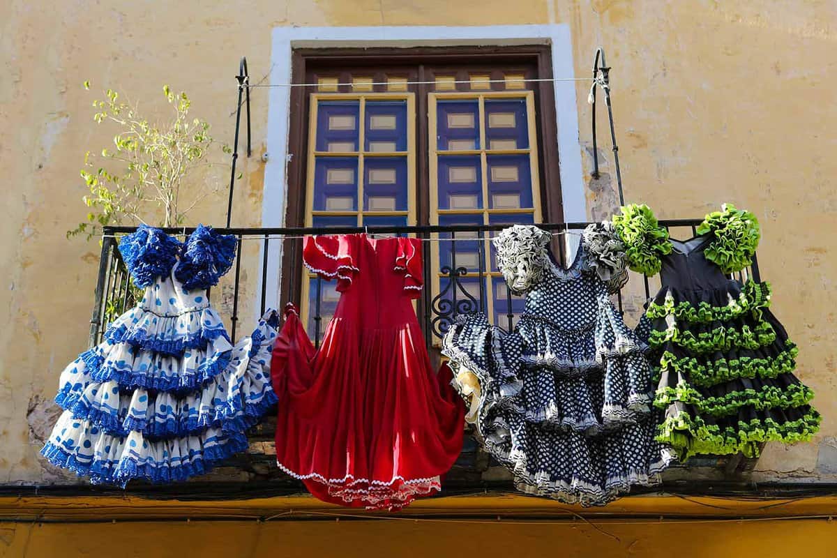 Flamenco dresses hand over a balcony to dry in the sun