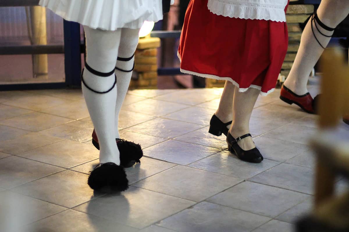 View of two people dancing in traditional dress