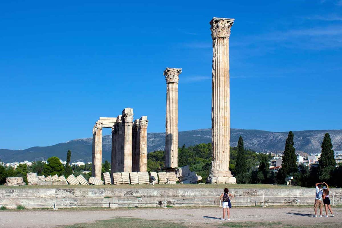 Pillars of Ancient Agora with tourists walking around
