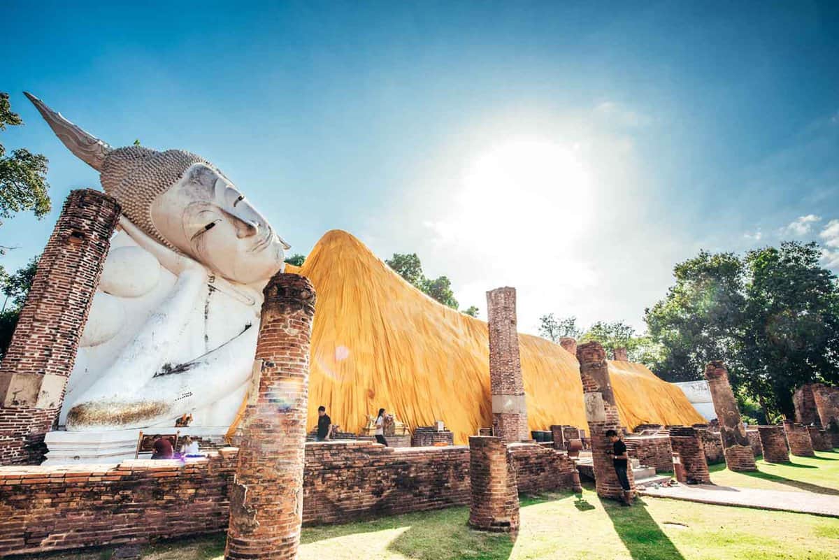 Ancient temple of a vast Buddha lying on his side