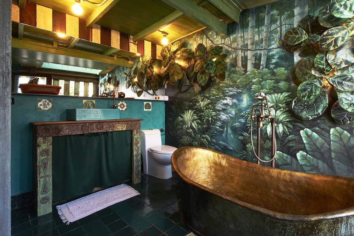 Copper tub in a wall painted with leaves