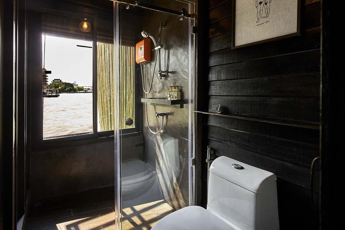 Bathroom with bamboo curtain with view of the river