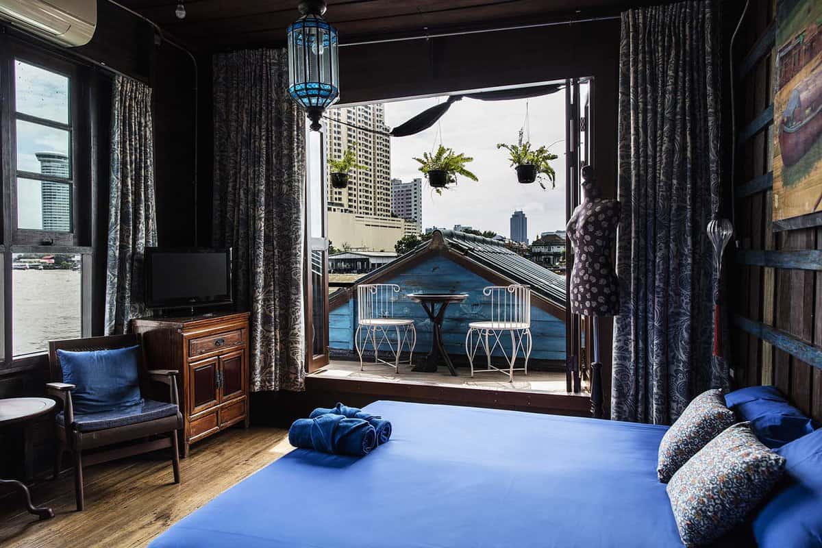 Blue accented bedroom with view of the river
