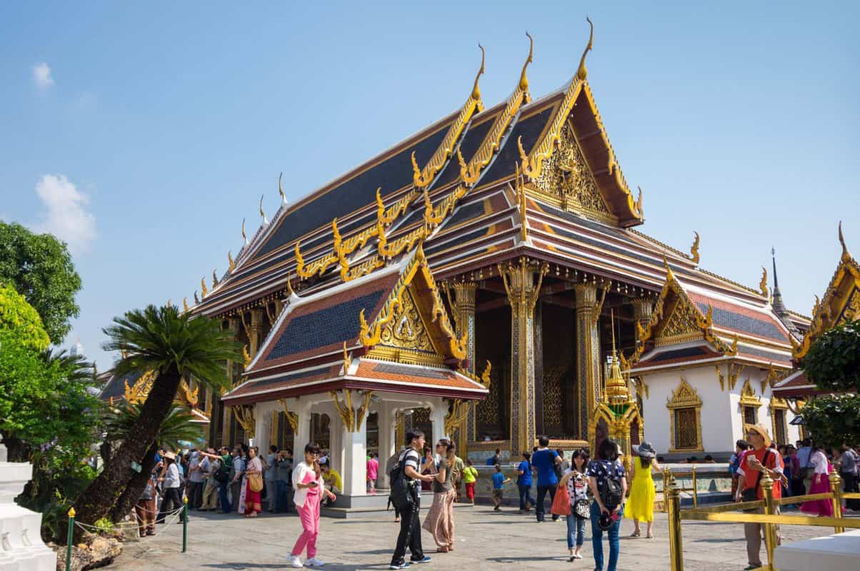 Temple of the Emerald Buddha with tourists standing in front