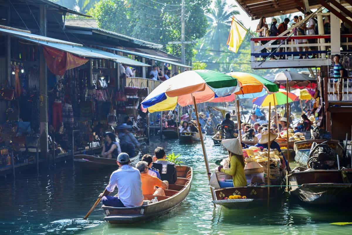 Boats filled with people on the Floating Market canal
