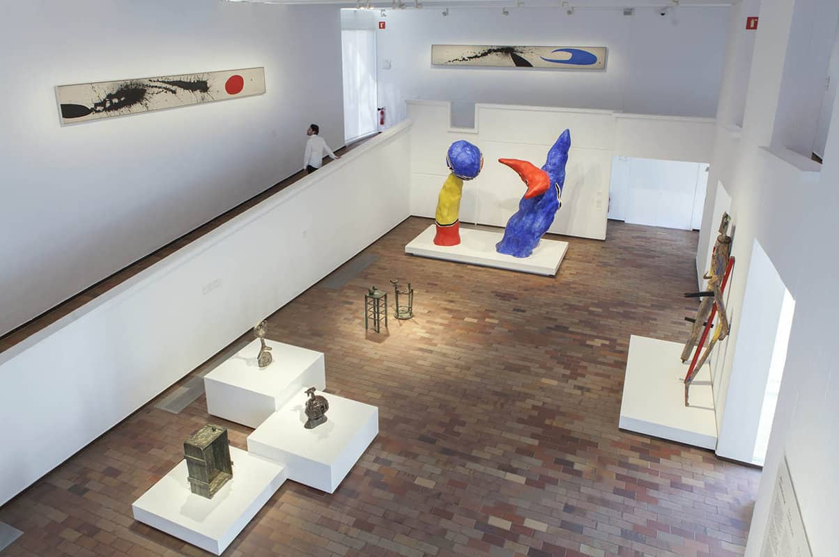 interior view of a gallery with some colourful modern artworks