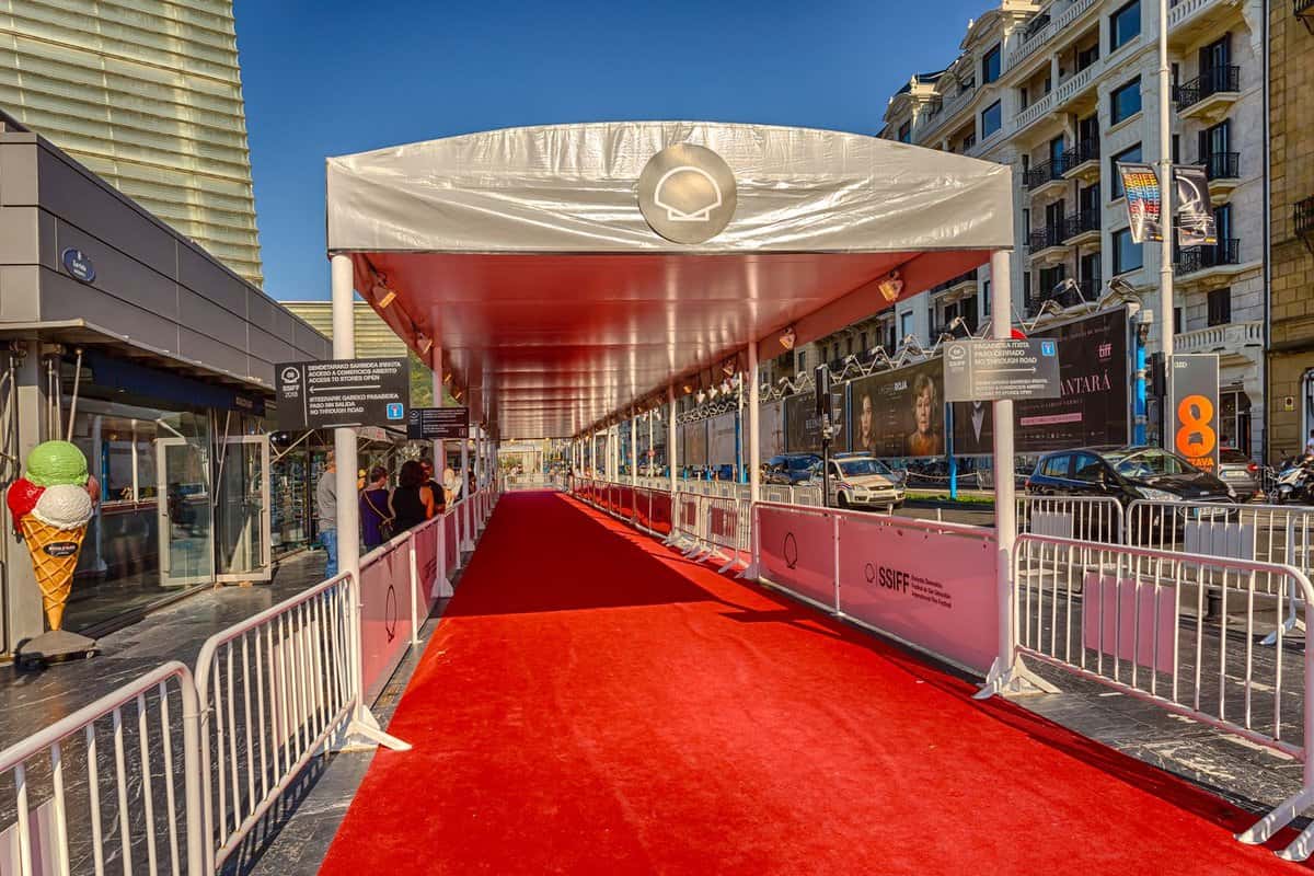 View of red carpet running into a covered walkway