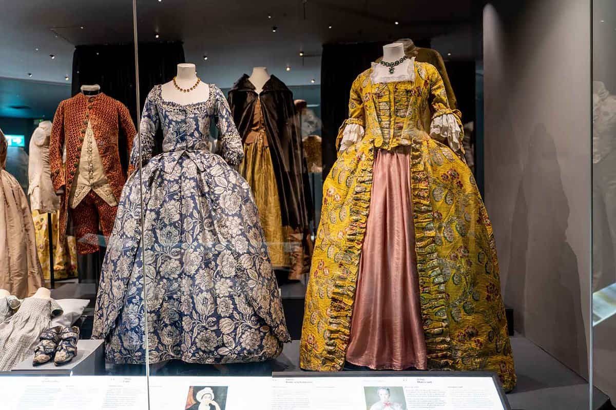 Elaborate dresses in a glass display case