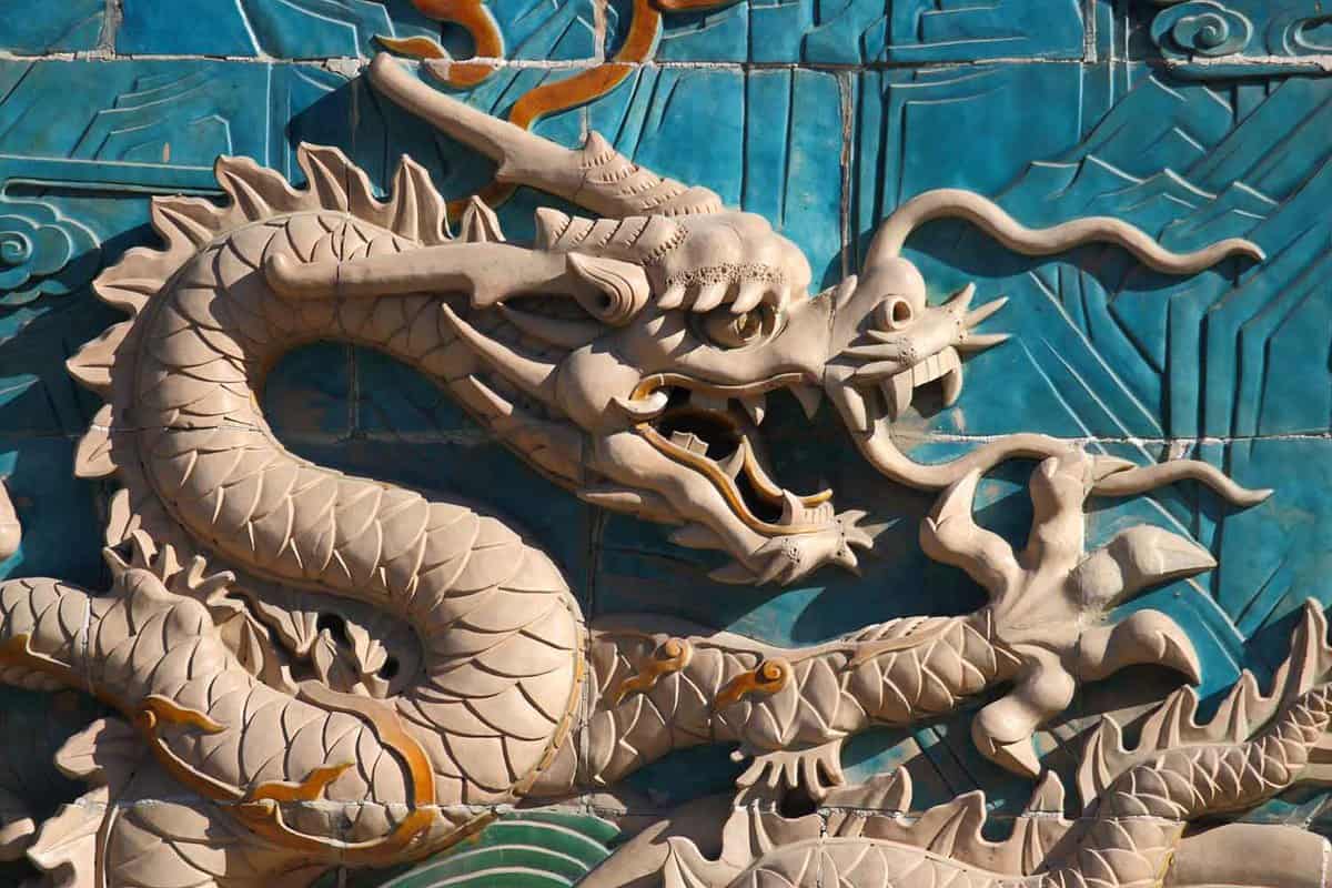 close up of a dragon sculpted on the Nine Dragon Screen in Beihai Park