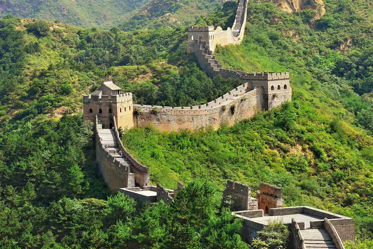 Crumbling Great Chinese Wall running down a hill, Huanghua Great Wall of  China, Great Wall