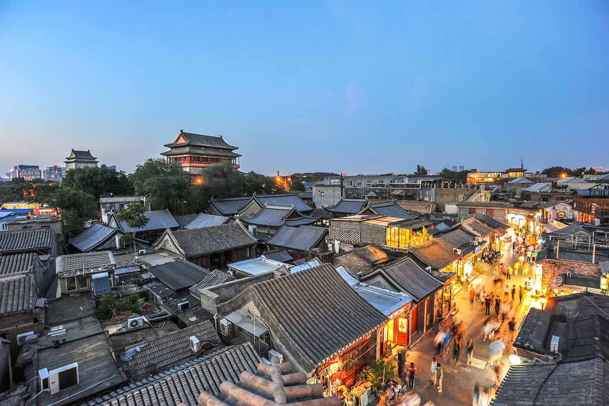 Rooftops and lighted street in Beijing's hutongs