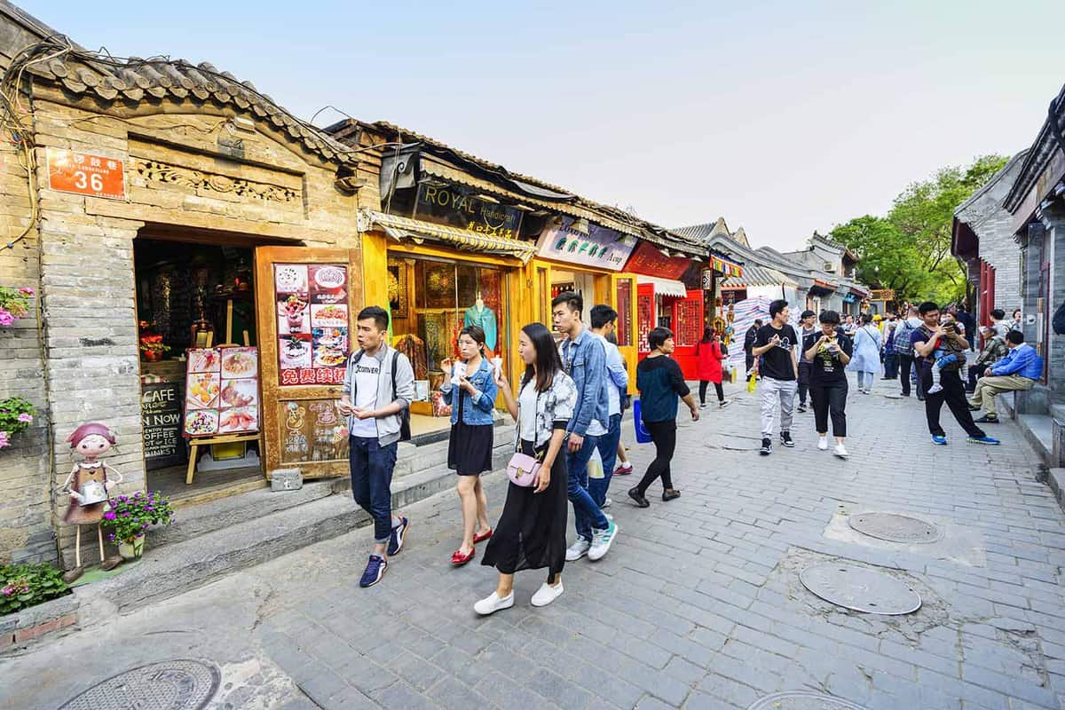 Ancient Nanluoguxiang of Beijing. People are walking. It is a well preserved ancient part of the town in Beijing, the street area also known as hutong, Beijing, China.