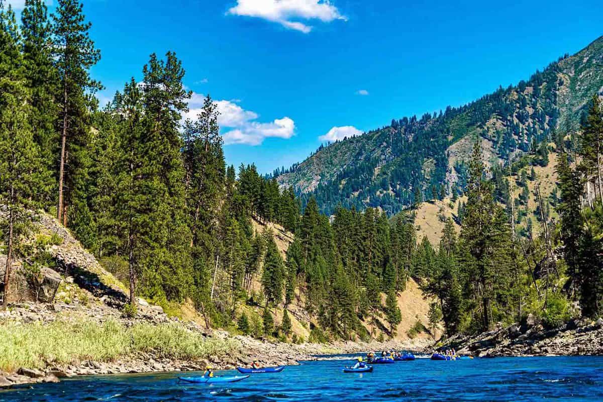 A beautiful river valley with cliffs and pine trees either side