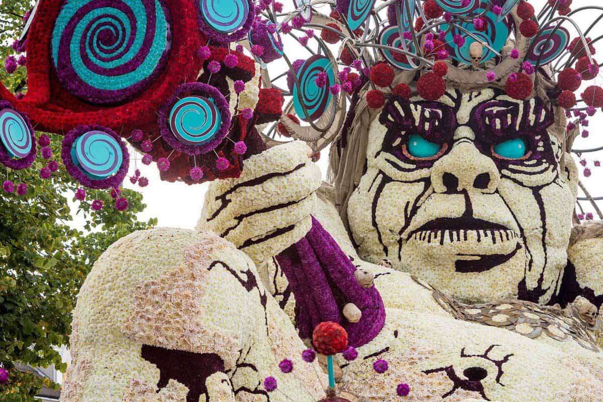 Close up of float with a giant white face