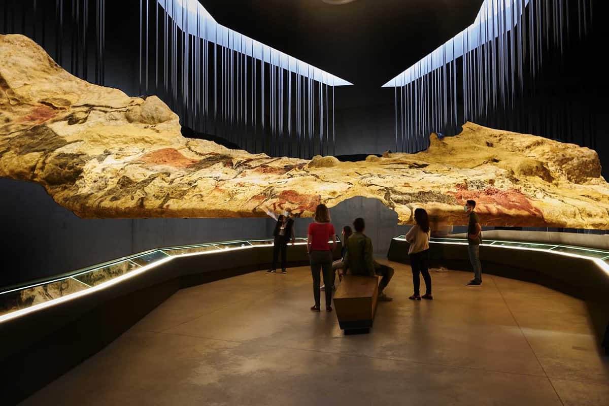 Interior gallery with large painting on display