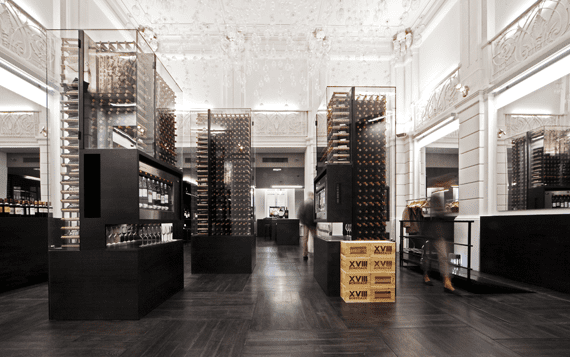 Inside the gallery, where there are racks of wine bottles