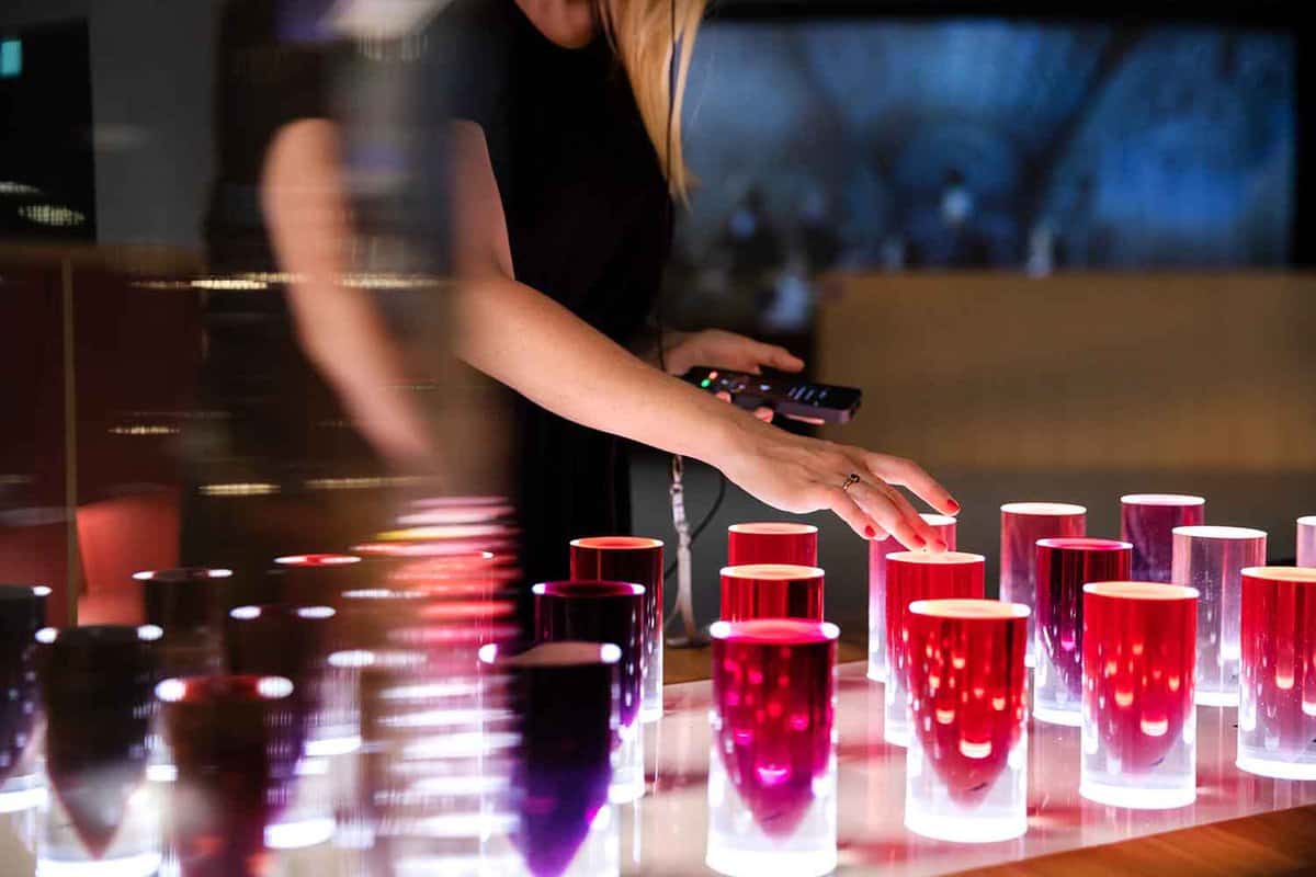 A person touching an interactive exhibit