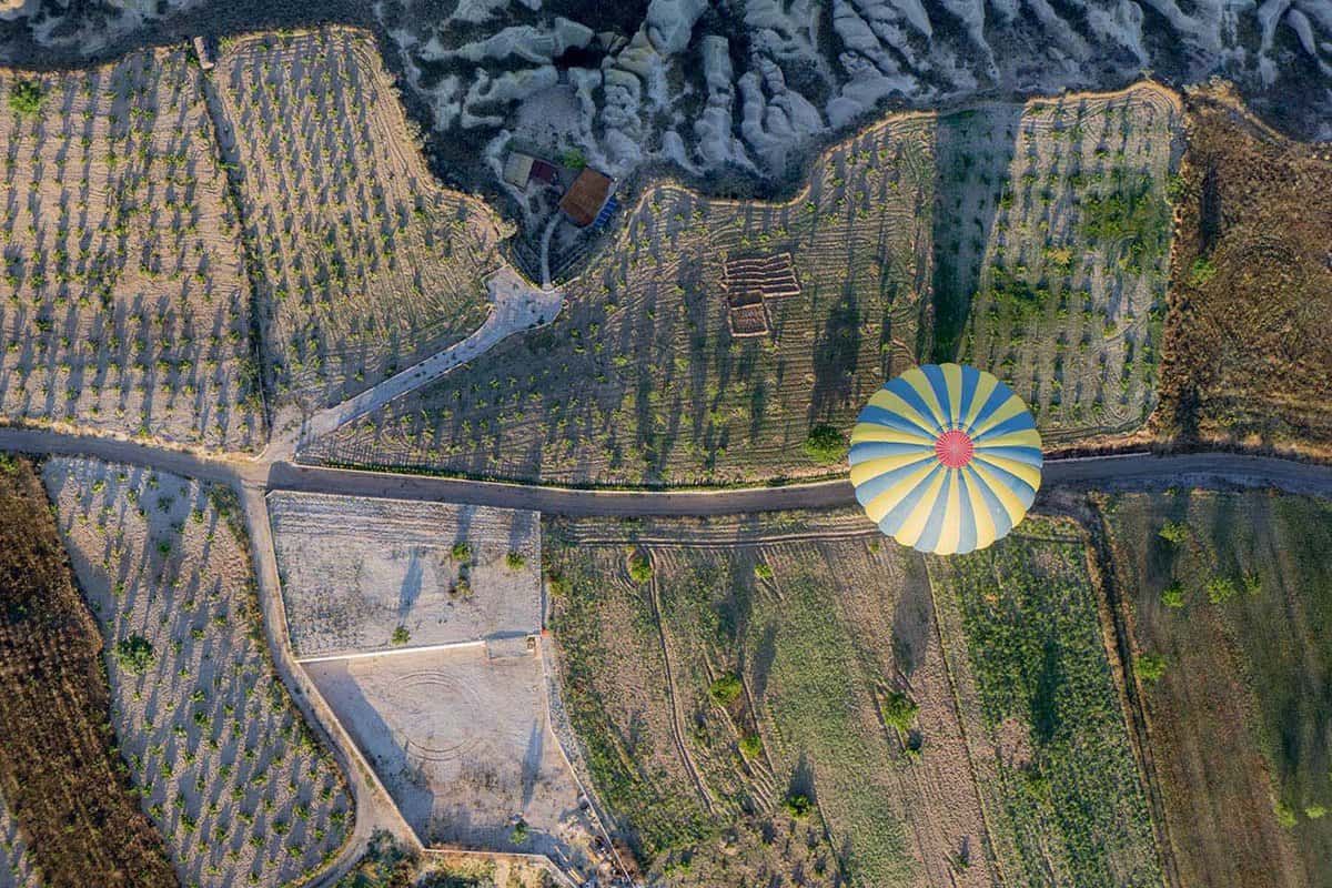 A photo from directly above a hot-air balloon.