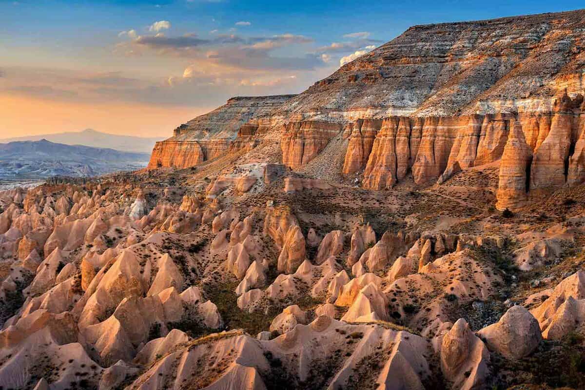 Beautiful mountains and Red valley at sunset in Goreme, Cappadocia in Turkey.