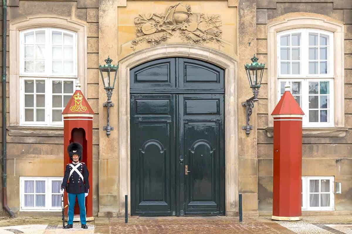 Royal guard in traditional uniform at the palace of Amalienborg, residence of the Danish royal family.