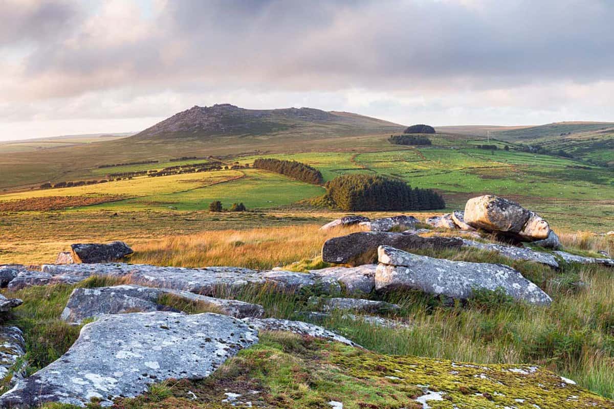 The rugged terrain of Bodmin Moor in Cornwall, withthe peaks of RoughTor and Brown Willy in the distance