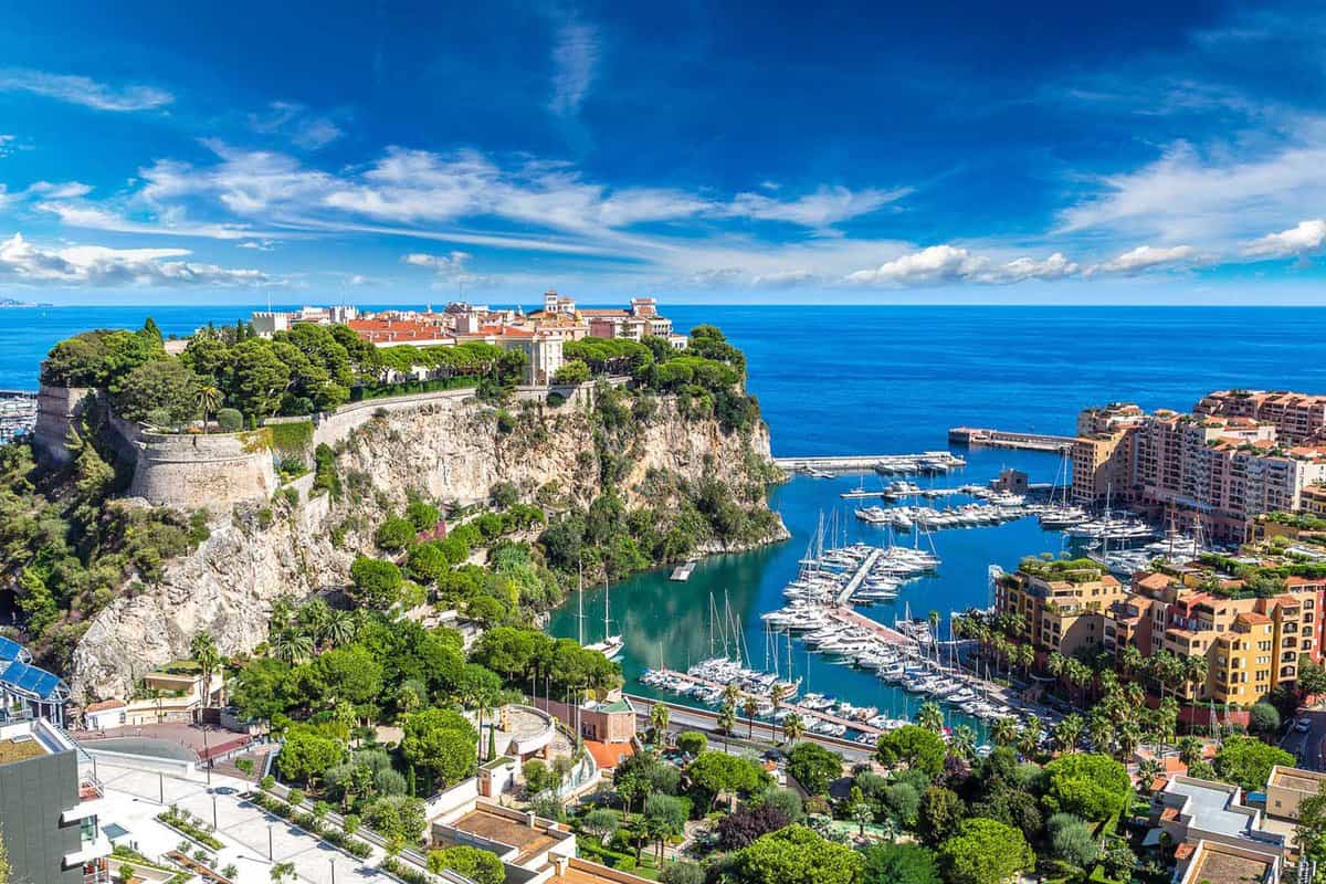 Landscape view of Monaco's marina, with palace on a hill the the left