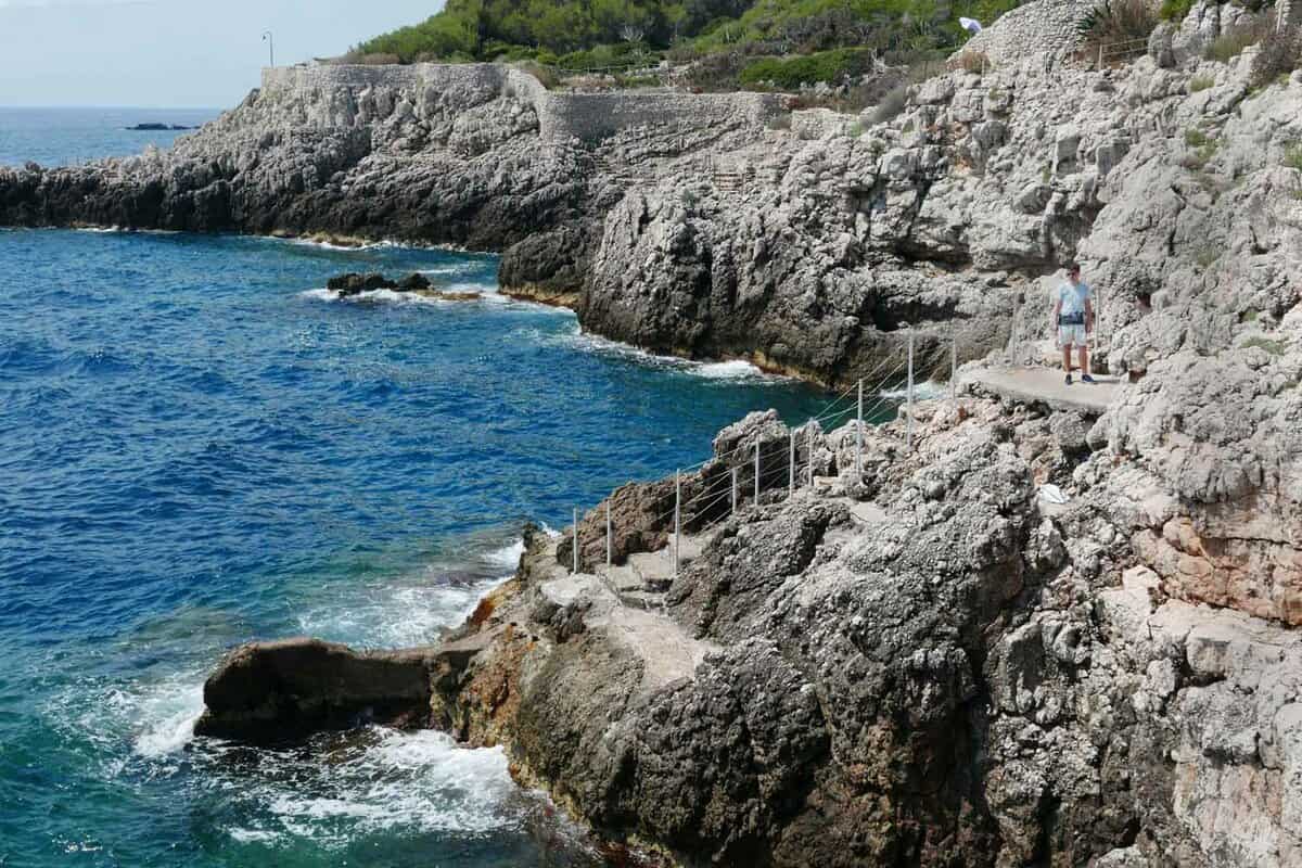 Man standing on a path in the cliffs at rocky Antibes