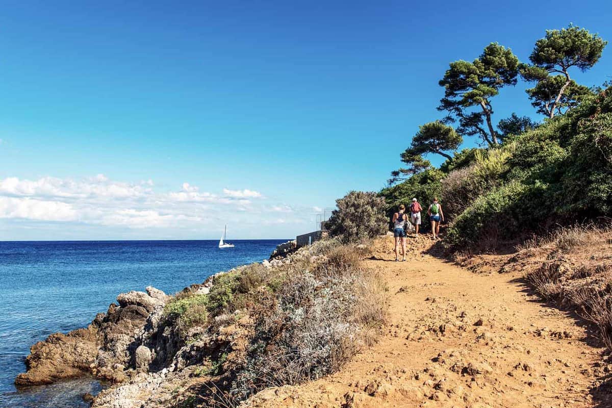 Small group walking along the Littoral coast path at Antibes