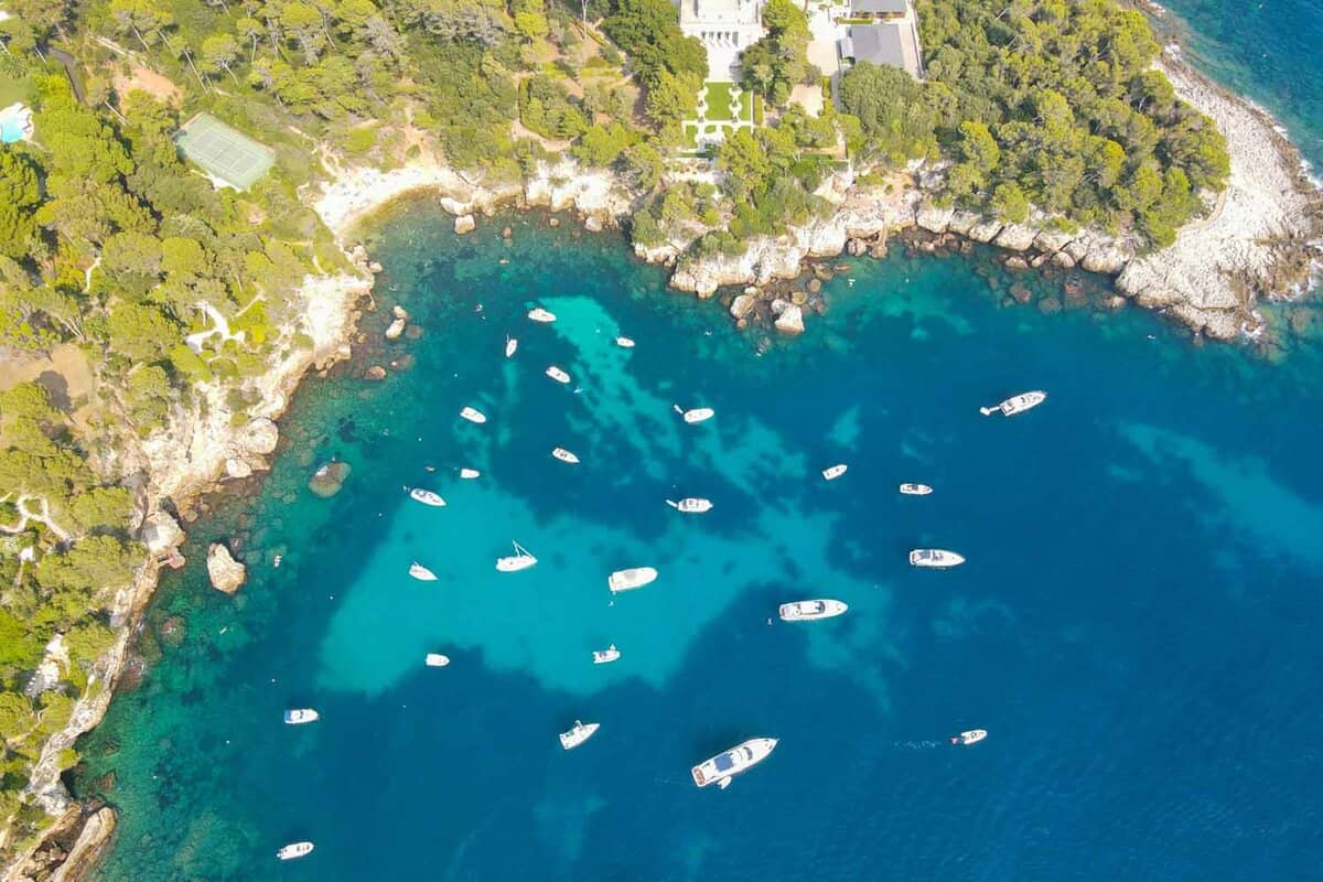 Aerial view of Cap d'Antibes and Billionaire's Bay, a beautiful rocky beach near coastal path on the Cap d'Antibes