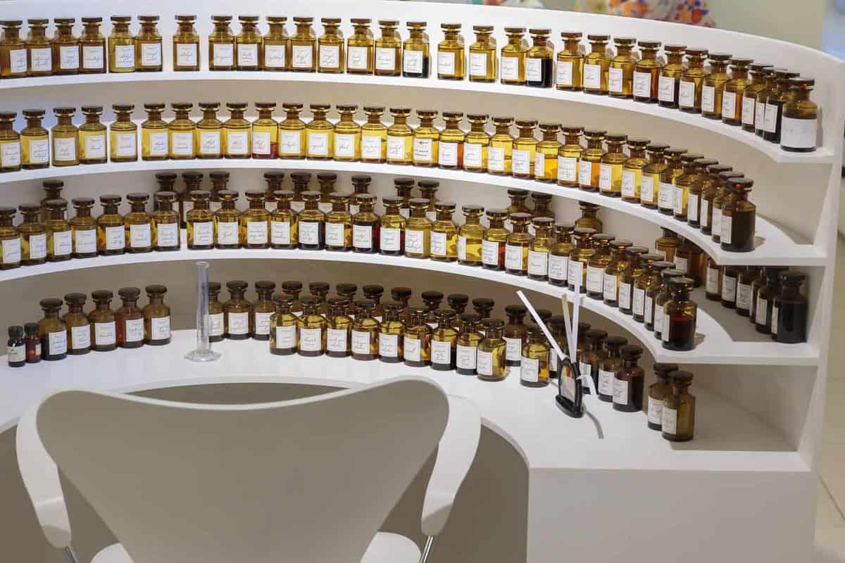 Rows of small glass, perfume vials in a perfume workshop