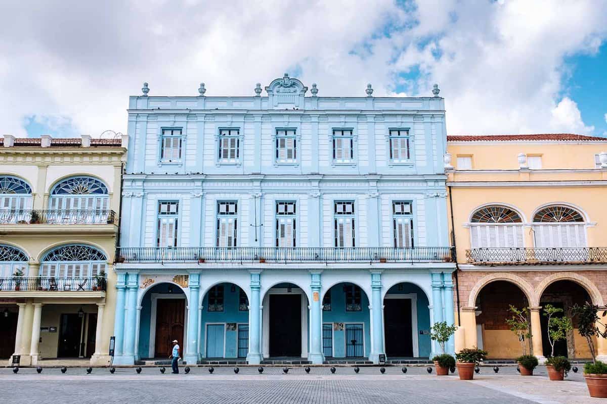 Colourful residences around the 16th-century colonial Plaza Vieja square in Old Havana in Cuba