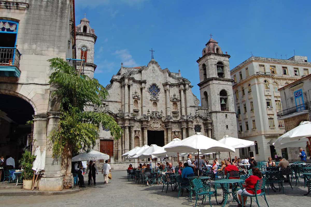 Tourists at a cafe in the square in front of the San Cristobal Cathedral in Havana, Cuba on January 26, 2009. The church is considered one of the most beautiful in the Americas.