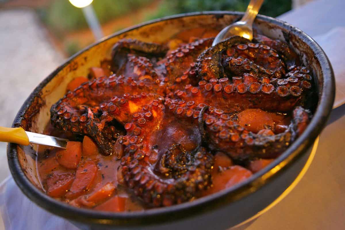 close up of cooked octopus in a bowl