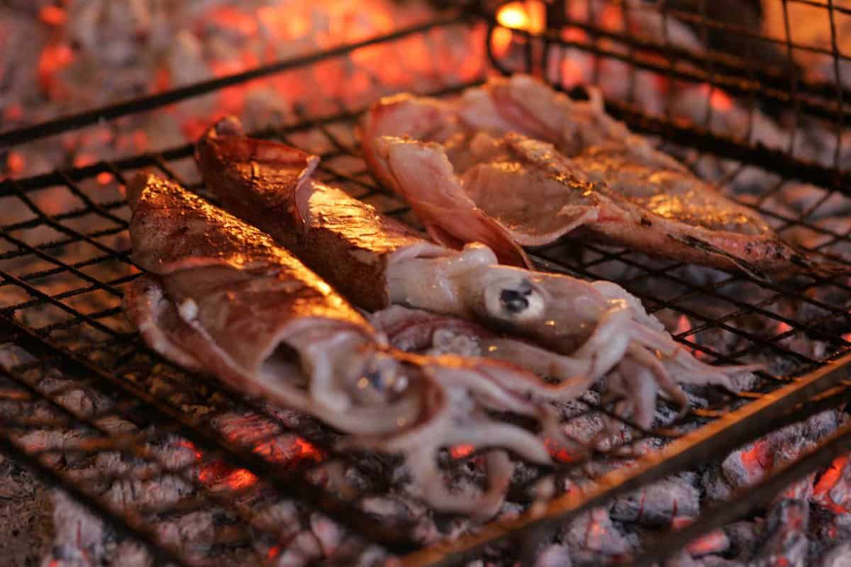 Grilled squid, next to the open fire, in konoba, Croatia.