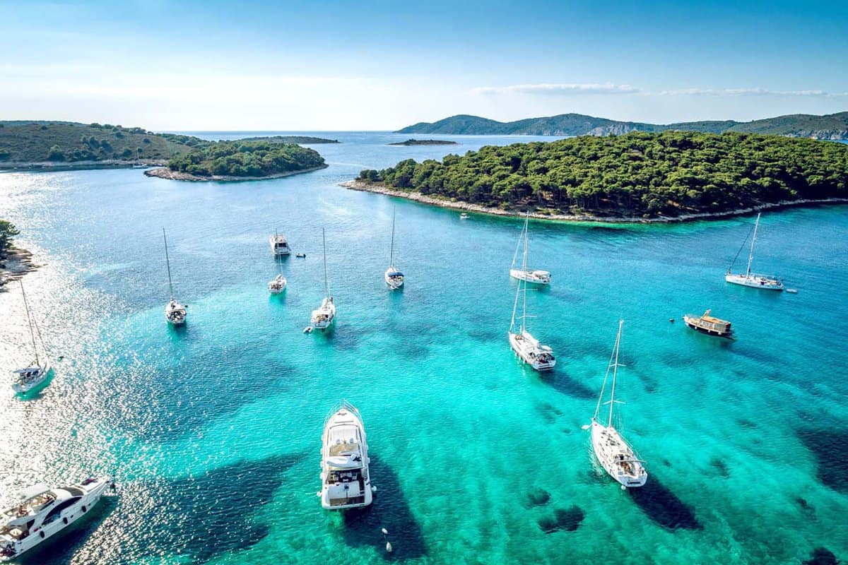Aerial view of Paklinski Islands in Hvar, Croatia. Turquise water bays with luxury yachts and sailing boats.