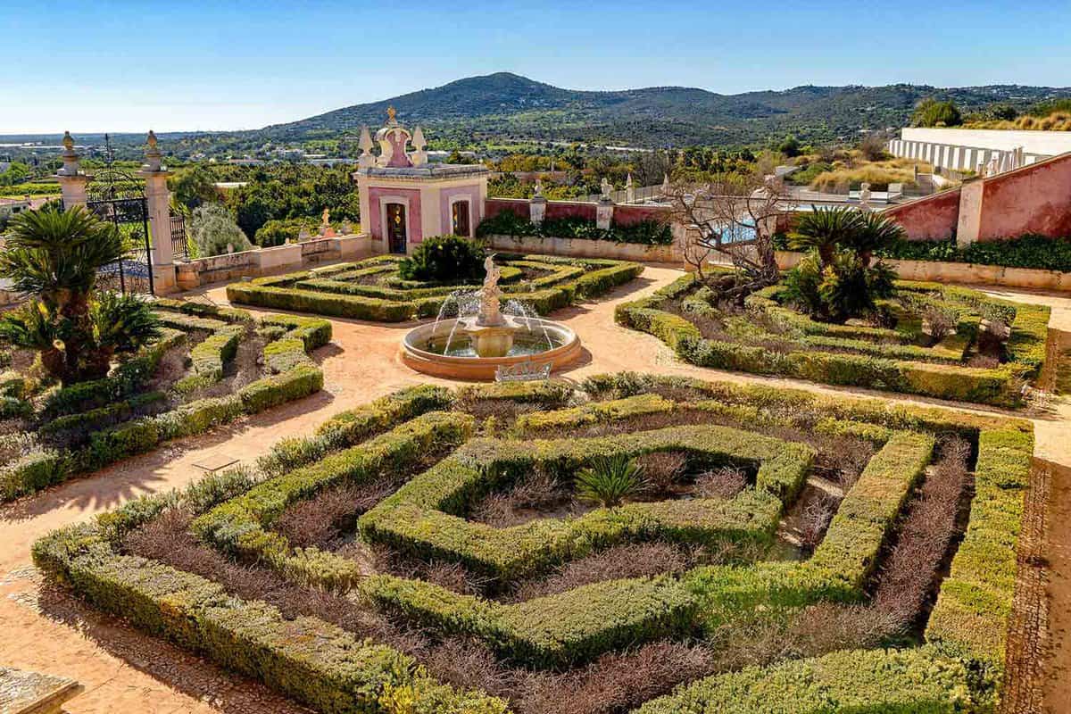 View of the gardens of the Palace of Estoi, a historic building that is now an luxury hotel; high angle view.