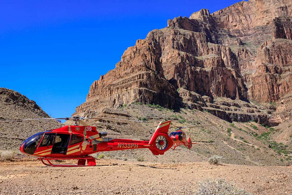 Scenic shot of a helicopter parked near the bottom of the Grand Canyon