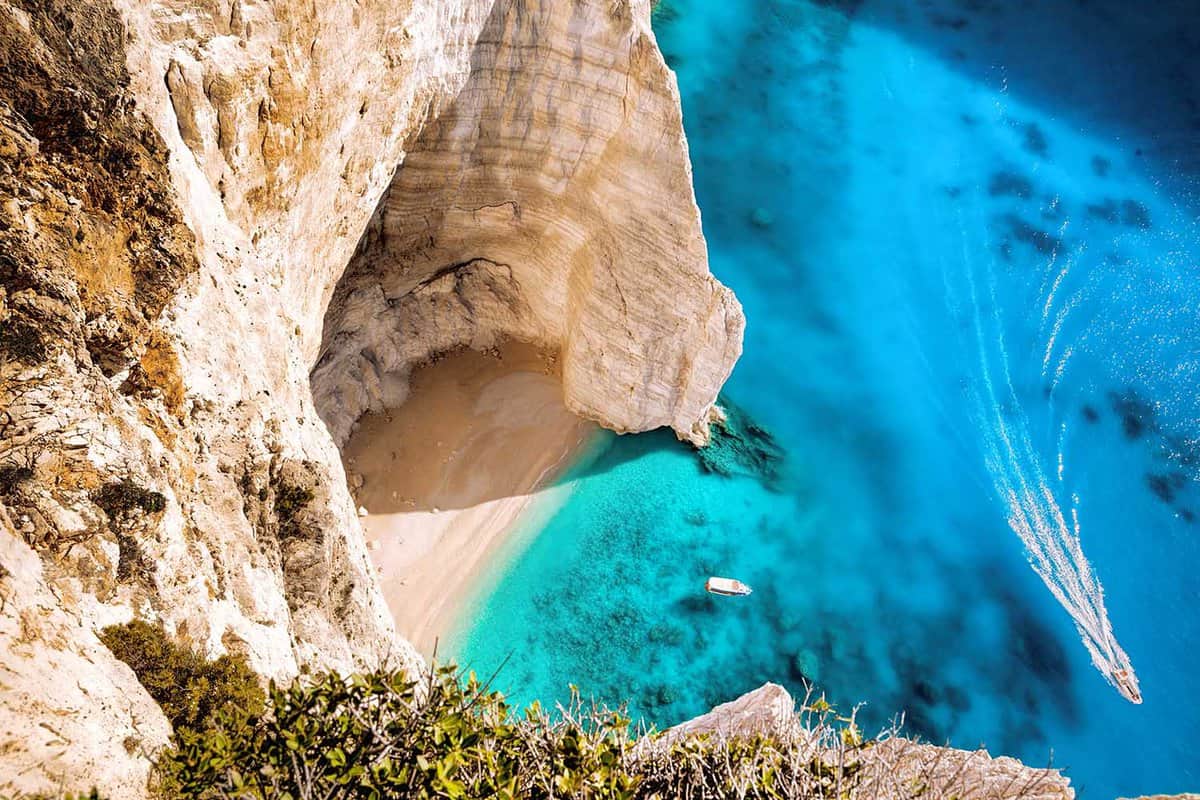 Navagio beach with boats on Zakynthos island in Greece