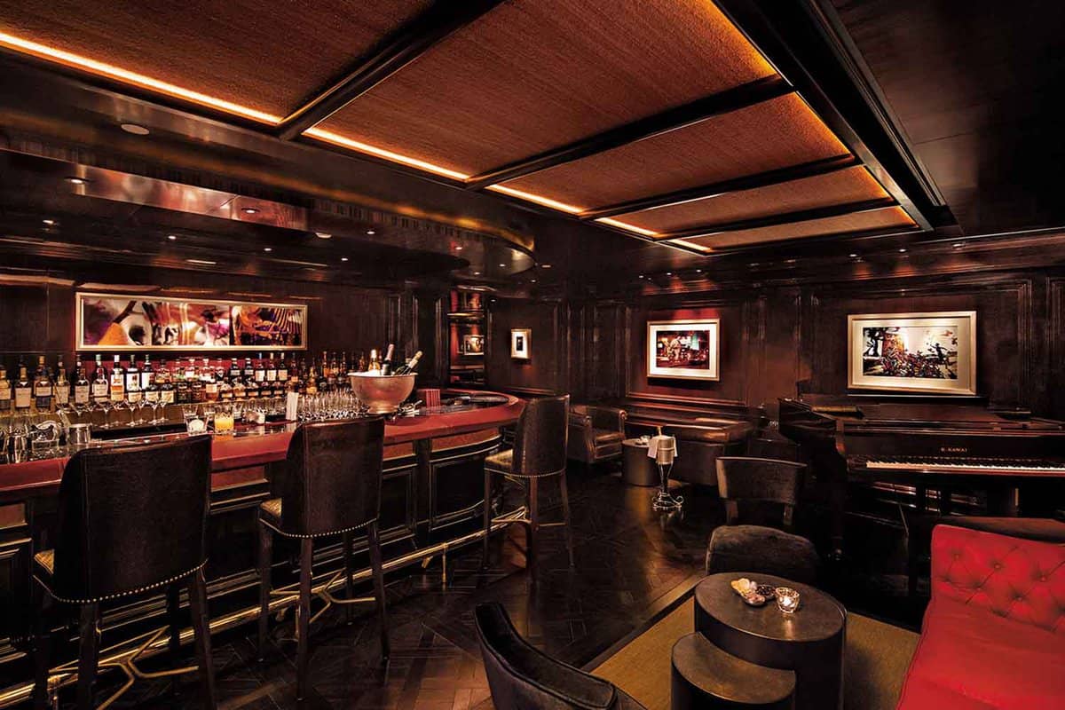 Warmly lit wood panelled bar area