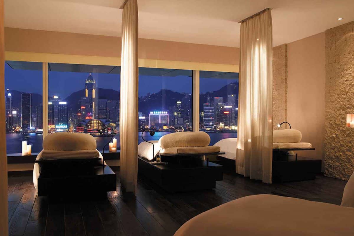Massage room with view onto the waterfront at night