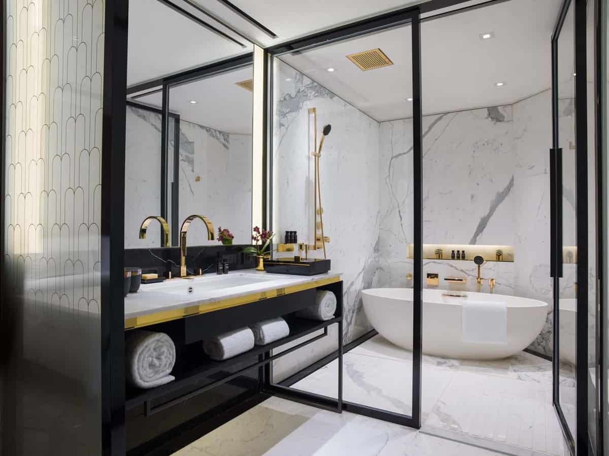 Stylish bathroom with gold taps and a large bath