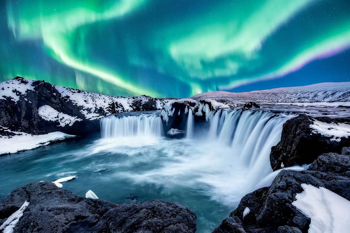A wonderful night with Northern lights The Godafoss is a waterfall in Iceland.