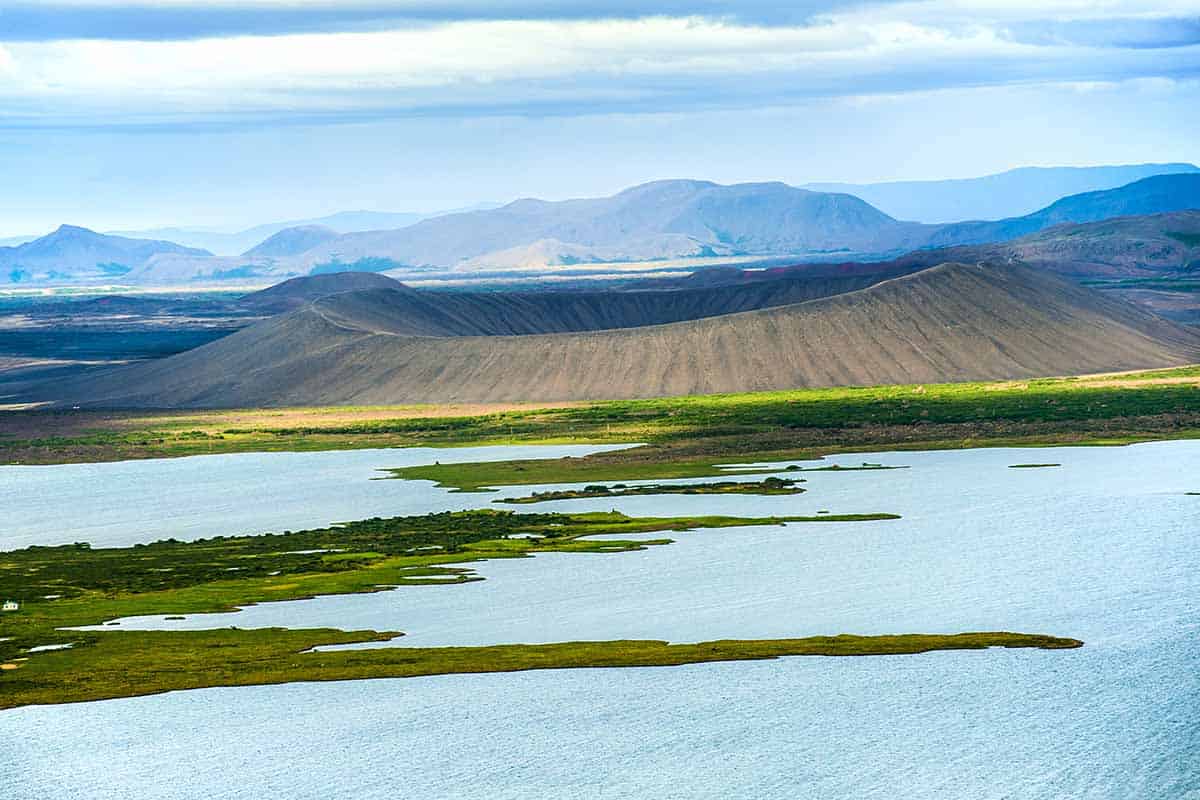 beautiful summer landscape of Lake Myvatn with volcano cone in centre